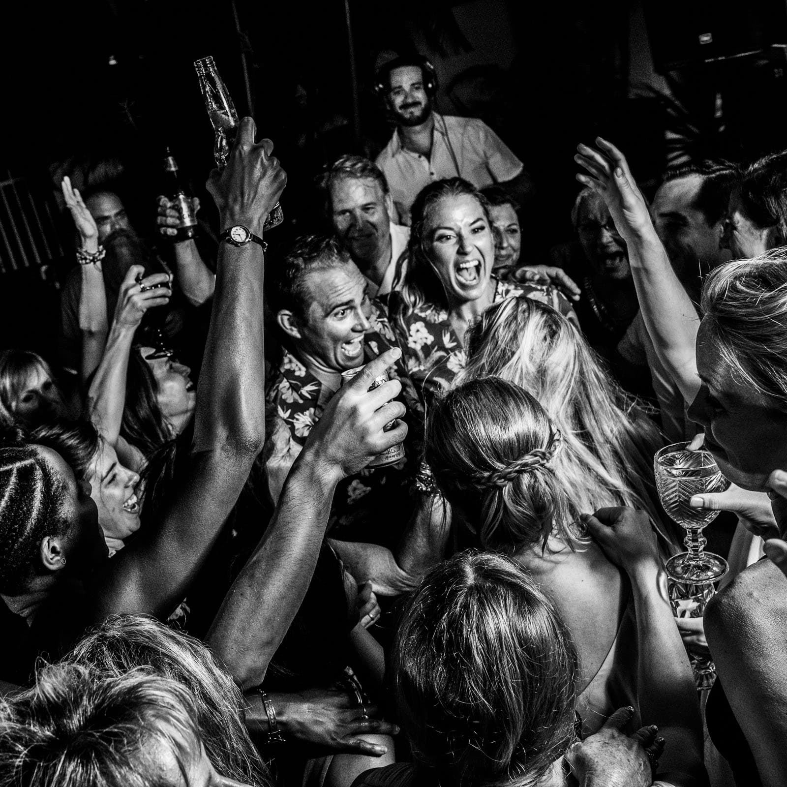 Candid Wedding Photography Austin Tx, Bride and Groom Laughing, Black and White Photograph of energetic crowd